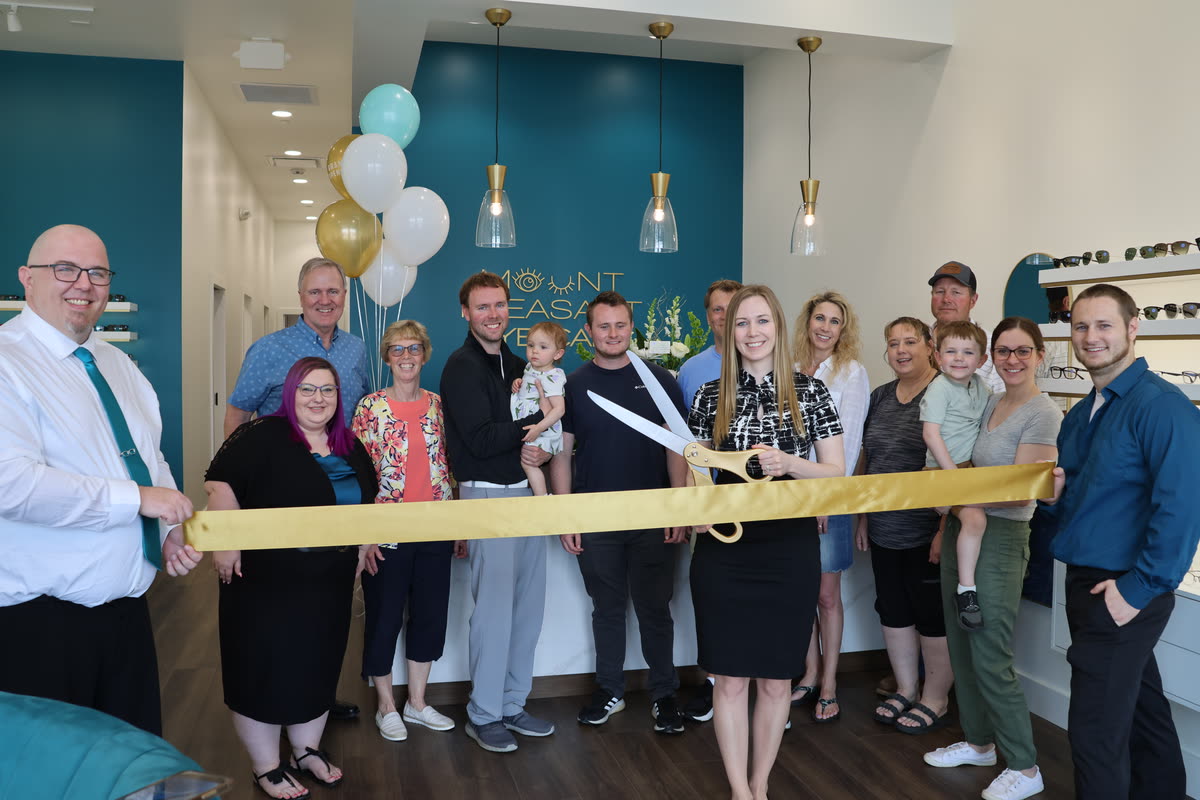 Family gathered together for the ribbon cutting at Mount Pleasant Eye Care
